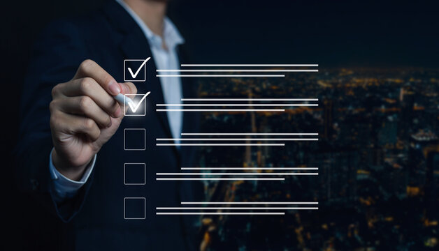 Businessman checking checklist digital interface, concept of business planning, task management, quality control, compliance, productivity, and corporate strategy, employee security procedures.
