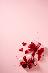Two elegant Valentine's Day gift boxes on a minimalist pink background, Flat lay.