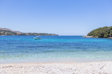 Fototapeta premium Wide angle view of a sunny, clear-water Mediterranean beach and coast