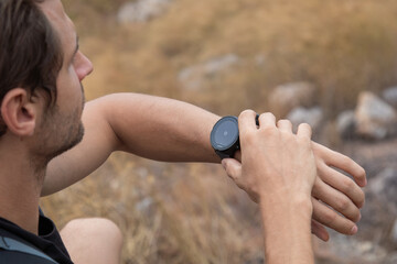 Tourist caucasian using smartphone adventure traveling lifestyle, handsome man backpacking walking trail in countryside using technology map by phone applications happy outdoor trip texting in park