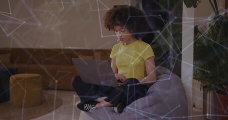 Animation of network of connections over a frican american businesswoman - Powered by Adobe