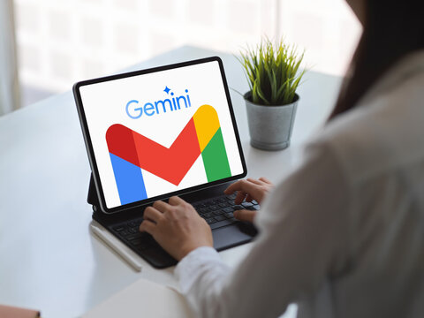 Person using gmail with google gemini ai on digital tablet