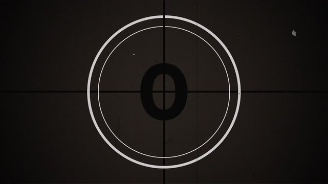 5 seconds short old movie countdown with vintage film leader aesthetics, featuring flicker, grain, dust and scratches. Ideal for quick transitions, cuts, and retro video edits.