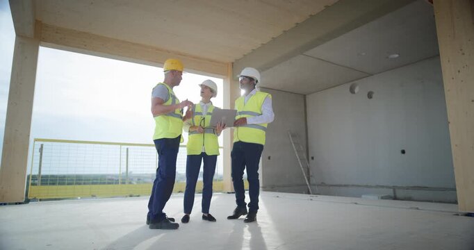 Three Professional Engineers Analyze Laptop Plans, Talk about Structural Options, Map Future Commercial Residential Spaces, Coordinating  Building Design, Tenant Flow, Real Estate Business Property