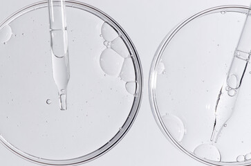 Liquid cosmetic product for the skin in a Petri dish.