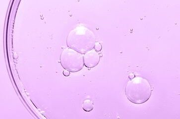 Liquid cosmetic product for the skin in a Petri dish.