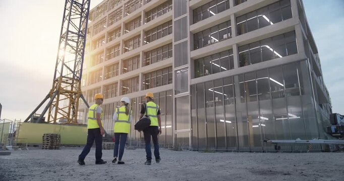 Construction Professionals, Walk Toward a Rising Office Structure While Overlay Graphics Reveal Augmented Reality Floor Plans, Digital Twin Data, Advanced Construction Visualization