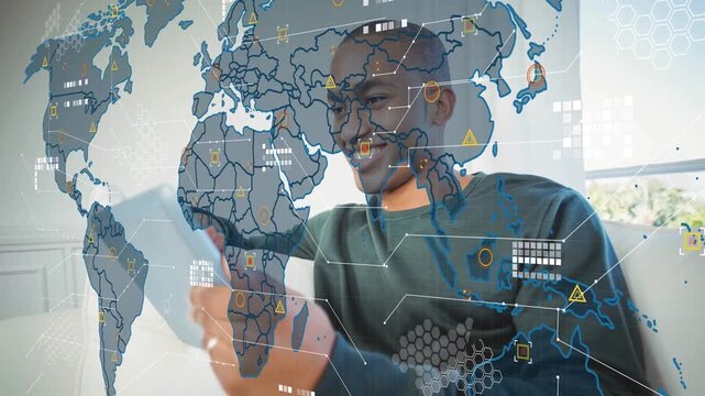 Data processing over world map against african american man using digital tablet