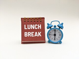 LUNCH BREAK text next to a blue alarm clock isolated on white background 