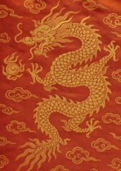 Obraz premium Golden dragon on red silk