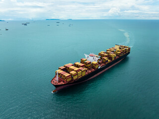 Aerial view of cargo container ship sailing in blue ocean for global business logistics and international import export trade transportation industry concept.