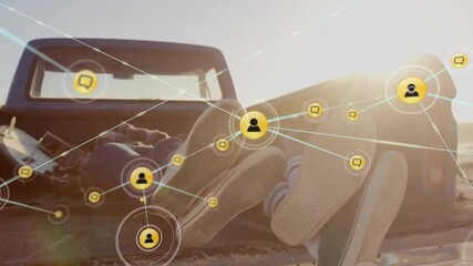 Animation of network of connections with icons over diverse couple in car by sea - Powered by Adobe