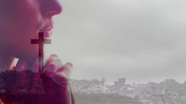 Praying person silhouette with cross overlay on rocky landscape in animation