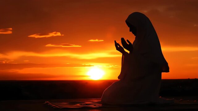 Silhouette of a Muslim woman performing dua against a vibrant sunset. Dramatic spiritual realism with golden hour rim light and rich fiery colors