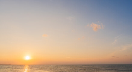 Sunset Sky, Golsen sun over Sea in the Evening with Orange sunlight, Horizon Sea sunrise Sky Landscape Background and Sun down in Golden Hour Summer Season, Dusk ocean Sky
