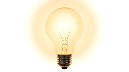 Glowing Light Bulb on White Background
