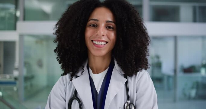Face, woman and doctor in hospital with smile for medical support, patient help and public service. Confident, happy person and healthcare worker in clinic with pride, career development or about us.