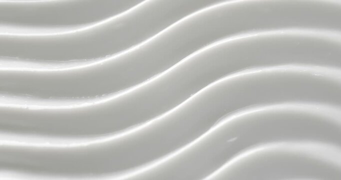 Cosmetic smears of creamy texture. Cosmetic skin cream. Beauty skincare product sample. Close-up footage of cream texture on rotating table