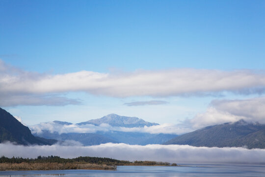 Morning clouds over Lake Brunner and mountains, West Coast, New Zealand