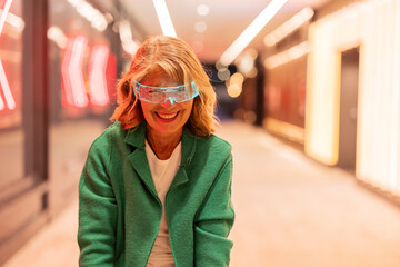 Woman smiling wearing VR headset outdoors at night in city