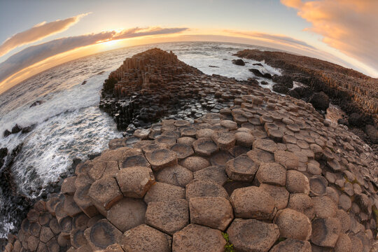 Hexagonal basalt columns at Giant's Causeway at sunset, Northern Ireland