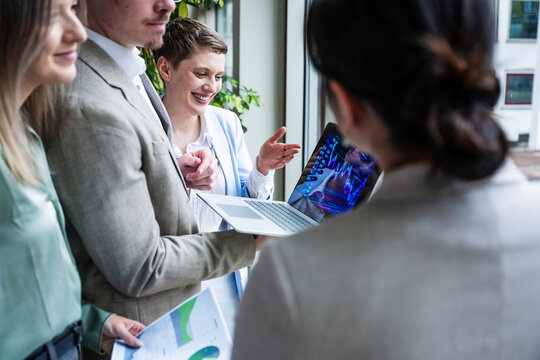 Team collaboration and discussion during business meeting in office
