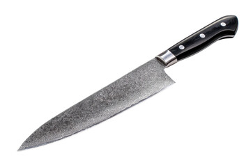 Large chef&rsquo;s knife with a textured steel blade, crisp mirrored highlights, balanced full-tang handle, and razor-sharp cutting edge isolated on transparent background.
