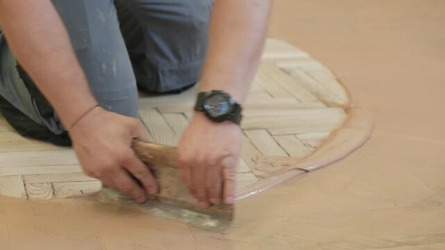 Professional hardwood floor restoration process in public building