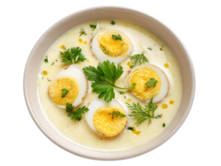 Bowl of creamy soup topped with sliced egg rounds and fresh herbs, smooth velvety consistency and comforting homemade feel isolated on transparent background.
