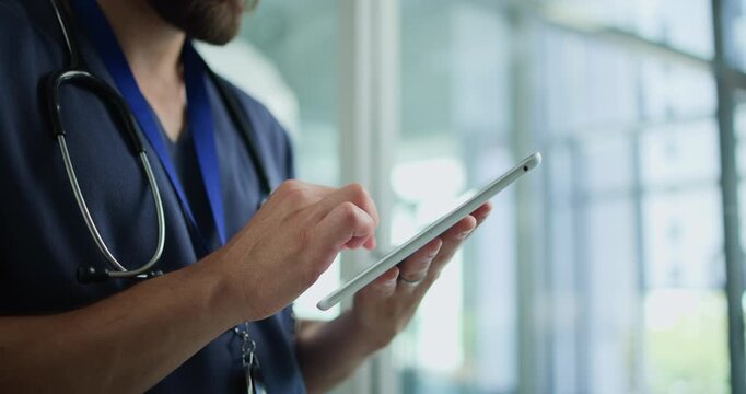 Hands, nurse and typing with tablet in clinic for patient information, appointment and schedule. Hospital, database and healthcare person with technology for telehealth, medical service or research