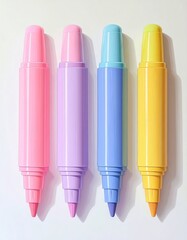 Four colorful highlighters standing upright on white