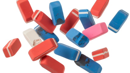 Colorful erasers falling in mid-air against a white background, creating a dynamic and playful scene