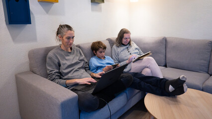 Family generation using digital devices on sofa at home