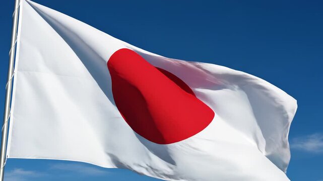 Japanese flag waving in blue sky