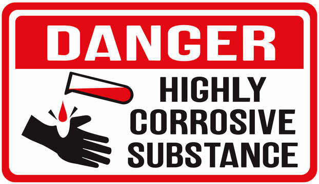 Sign that says : danger,  highly corrosive substance