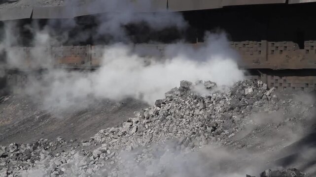 Coke oven plant in operation producing hard but reactive metallurgical coke for blast furnace use.