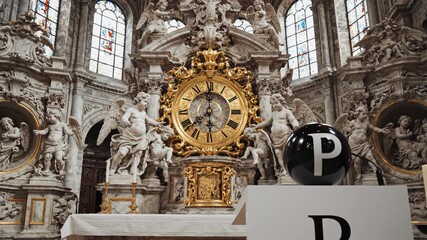 Ornate church altar with clock and statues
