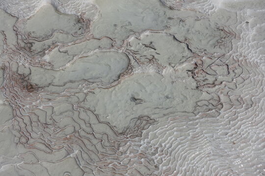 Carbonate mineral patterns left by the flowing of thermal spring mineral rich water at Pamukkale
