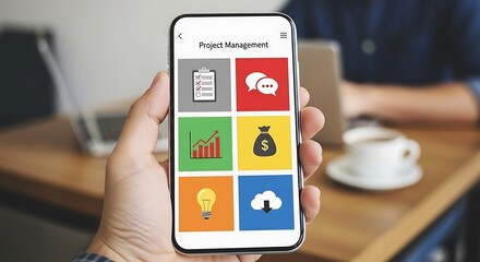 Person holding smartphone with project management app interface