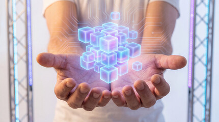 Person holding digital cubes in hands representing data storage and cloud computing technology