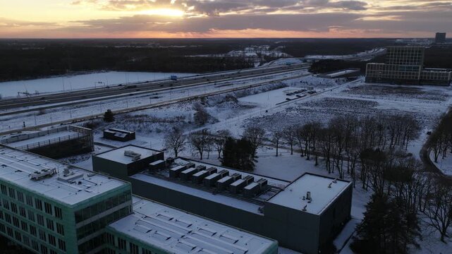 Aerial drone video of a datacenter at High Tech Campus Veldhoven during winter sunset, highlighting computing power, colocation services, data storage, and modern digital infrastructure.
