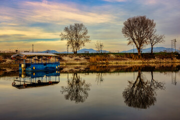 Blue Boat Reflected on Calm Waters &mdash; Kerkini, Northern Greece