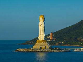 Aerial view of Guanyin statue at seaside in nanshan temple, hainan island , China. Words mean mercy and blessing.