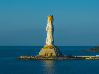 Aerial view of Guanyin statue at seaside in nanshan temple, hainan island , China. Words mean mercy and blessing.