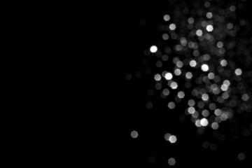 White gray blurred bokeh lights on black background. Glitter sparkle stars for celebrate. Overlay for your design