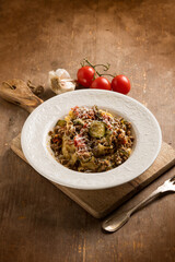 Tagliatelle with white ragout zucchinis and tomatoes