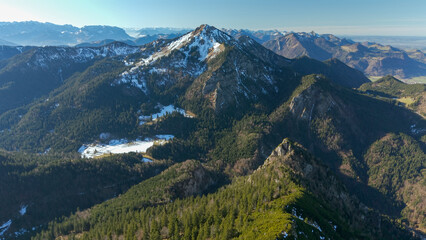 Fototapeta premium Chiemgau mountain valley landscape close to the Hochfelln peak during winter and autumn season 