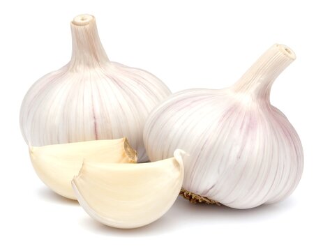 Two whole garlic bulbs with a clove