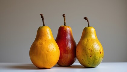 Fresh and Colorful Pears on a White Surface with Soft Lighting and Neutral Background for Food Photography