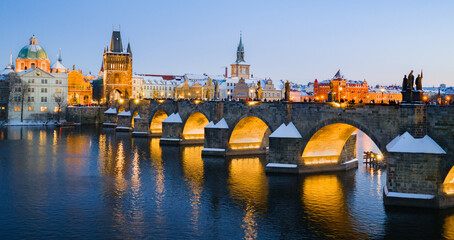 Fototapeta premium High Resolution Panorama Picture of Winter Snowy Prague Old Town with Prague Castle and Charles Bridge above River Vltava during Sunset , Czech republic